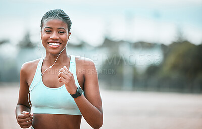 Buy stock photo Portrait, outdoor and black woman running, fitness and workout goal for wellness, health and cardio. Face, female person and runner with earphones, motivation and exercise with training and sports