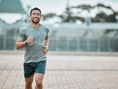 Buy stock photo Sports, portrait and male athlete running with earphones for music, radio or podcast for motivation. Fitness, exercise and man runner in outdoor cardio workout routine for race or marathon training.
