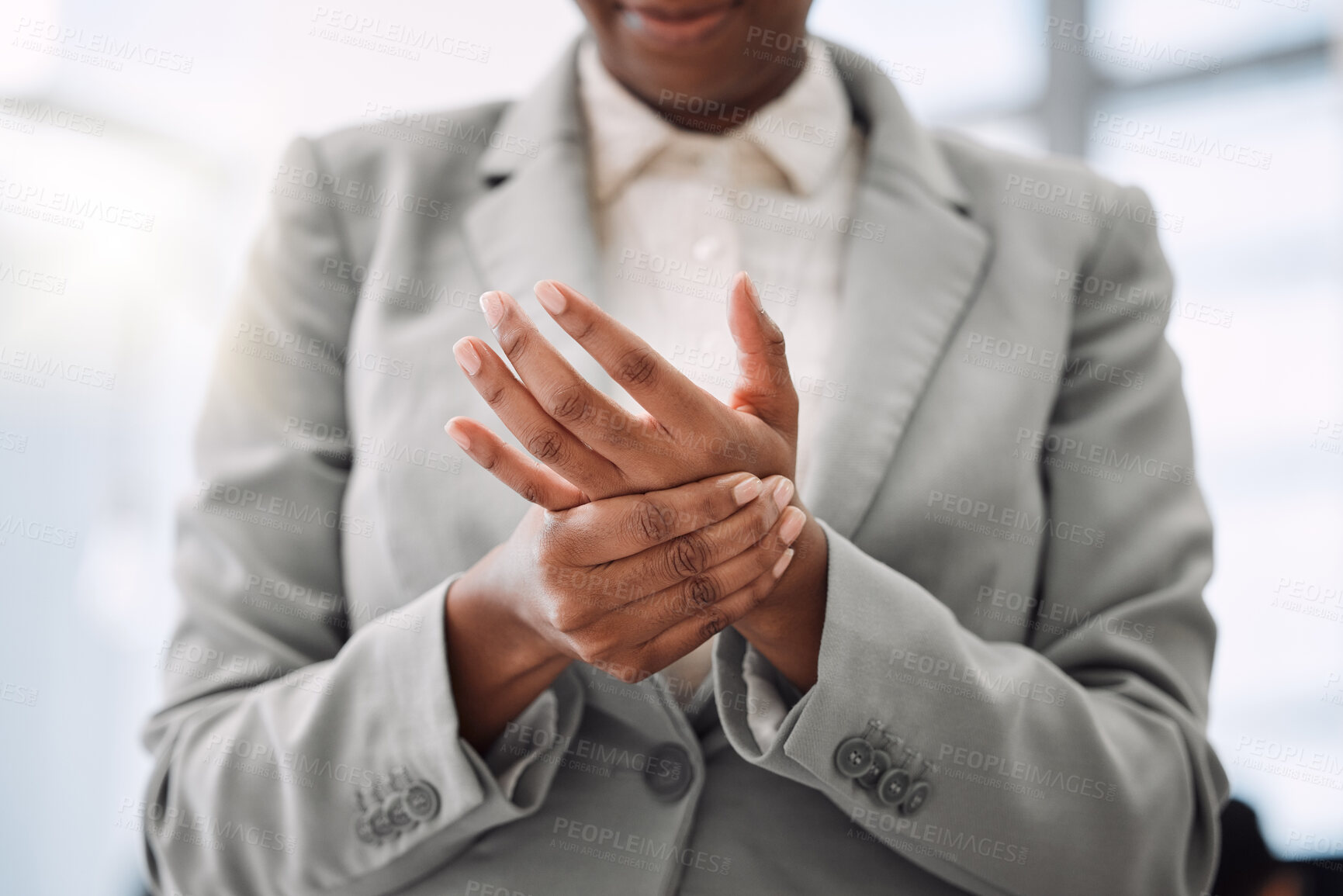 Buy stock photo Closeup shot of an unrecognisable businesswoman experiencing hand pain while working in an office