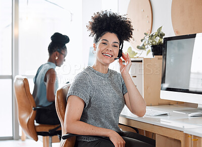 Buy stock photo Portrait of a young call centre agent working in an office with her colleague in the background