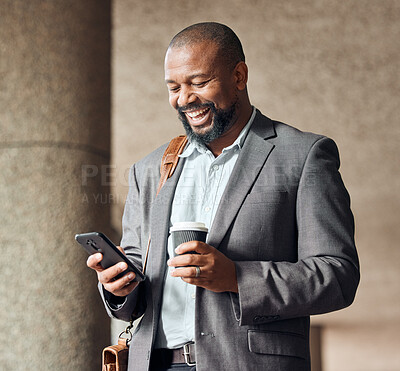 Buy stock photo Phone, coffee and businessman in the city walking to corporate office while networking. Happy, town and African male employee browsing on social media, mobile app or internet while commuting to work.