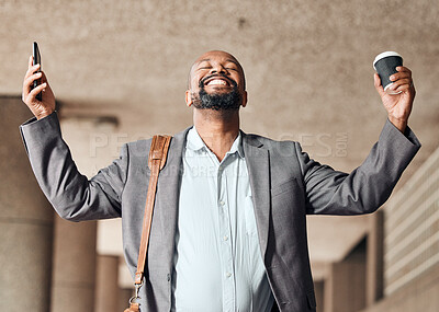 Buy stock photo Shot of a businessman cheering while using his smartphone