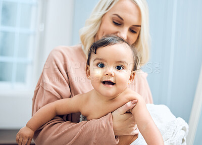 Buy stock photo Shot of a woman bonding with her adorable baby girl