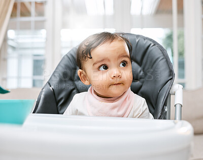 Buy stock photo Shot of an adorable baby girl sitting in her feeding chair