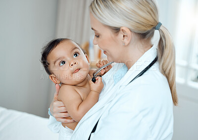 Buy stock photo Shot of a paediatrician examining a baby in a clinic