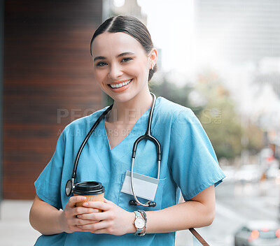Buy stock photo Shot of a young female doctor having a coffee at work