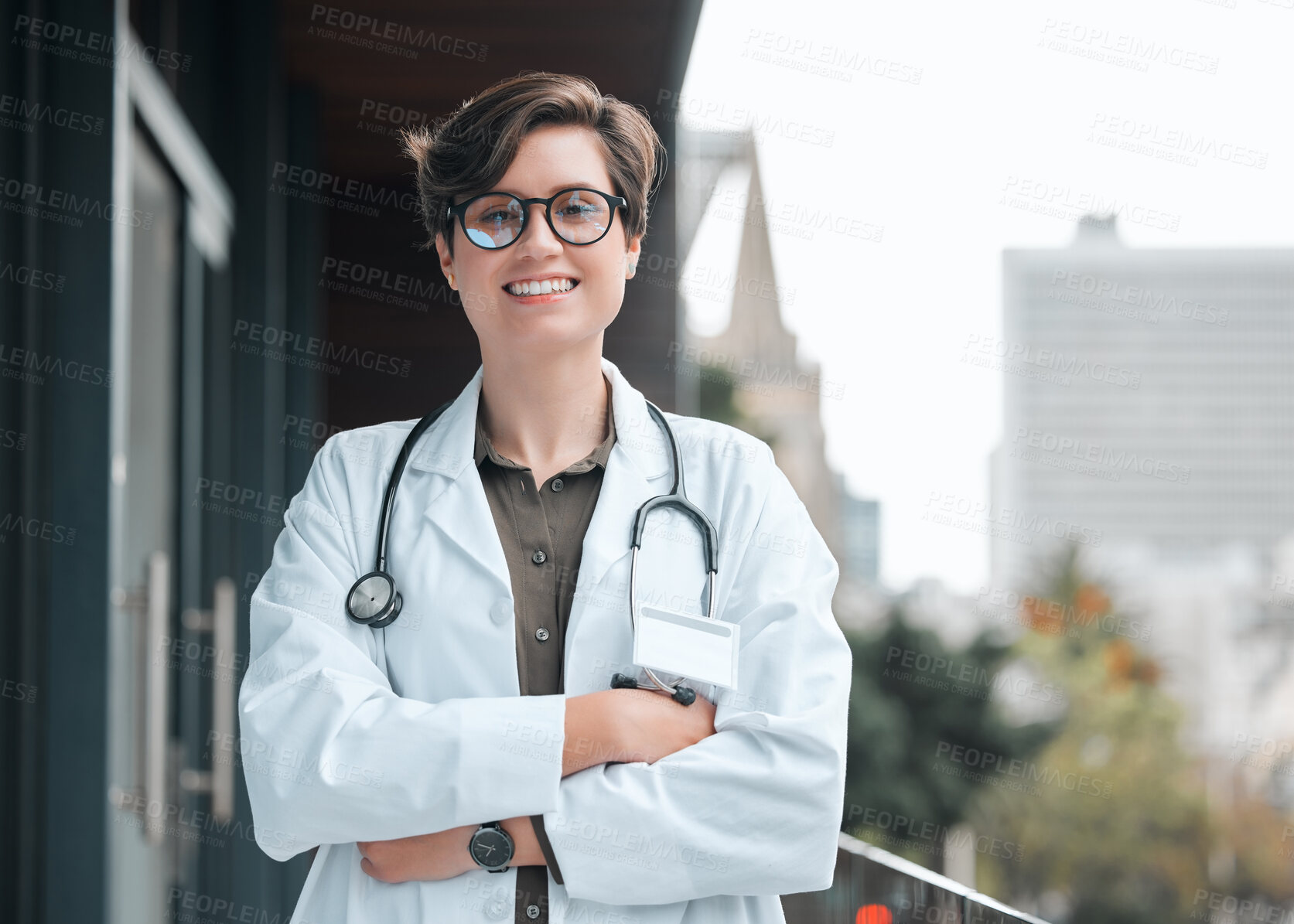 Buy stock photo Portrait, happy woman and doctor with crossed arms for healthcare services, career or medicine in hospital. Proud, medical professional and confident physician with smile in clinic or outdoor balcony