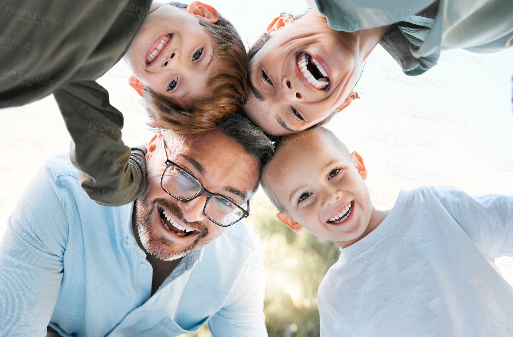 Buy stock photo Family, portrait and smile with huddle in outdoor for bonding, affection and playful for childhood fun on weekend break. Mother, father and children together in park for sunshine, play and low angle.