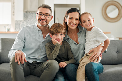 Buy stock photo Family portrait, kids and hug in home for love, peace and connection for bonding on sofa. Parents, children and embrace for security on couch for care in childhood, relationship and comfortable