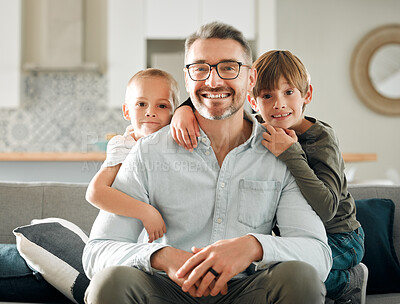 Buy stock photo Dad, kids and hug on sofa portrait, peace and single parent love for boys in living room. Father, children and embrace for security on couch for care in childhood, relationship and comfortable home