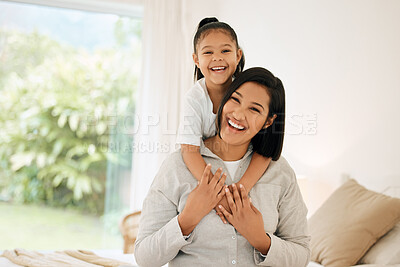 Buy stock photo Portrait of a young mother and daughter bonding together at home