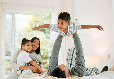 Buy stock photo Airplane, family and father with boy, bed and happiness with bonding, loving together and laughing. Love, parents and siblings in a bedroom, brother and sister playing games, fun and weekend break