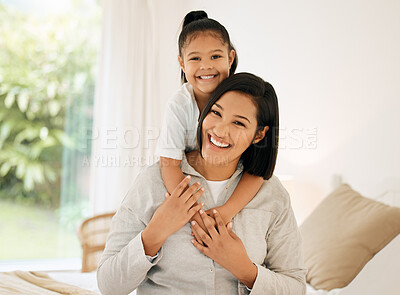 Buy stock photo Portrait of a young mother and daughter bonding together at home
