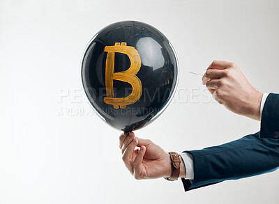 Buy stock photo Business, man and hands with popping balloon in studio on white background for crypto collapse. Male person, digital currency and stock market for trading or bankrupt with finance, money and capital