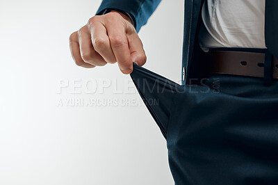 Buy stock photo Businessman, hand and empty pocket for debt, financial problem and budget stress in studio. Bankrupt, fingers and money or payment crisis with stock market crash and investor by white background 