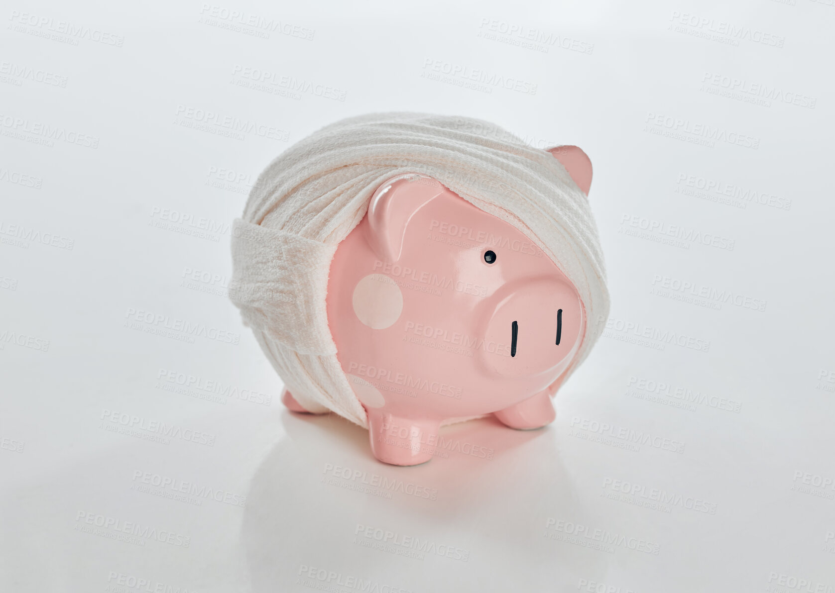 Buy stock photo Bandage, bankruptcy and piggybank on studio white background for audit, debt or recession. Economy, finance and tax with damaged money box on table for investment, savings or wealth management