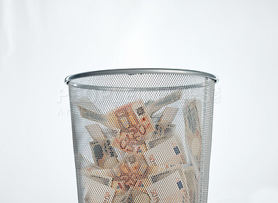 Buy stock photo Cash, euro and waste basket of paper currency from crime, fraud and money laundering in studio. Garbage, bin and financial bankruptcy and debt from bad investment and inflation with fake notes scam