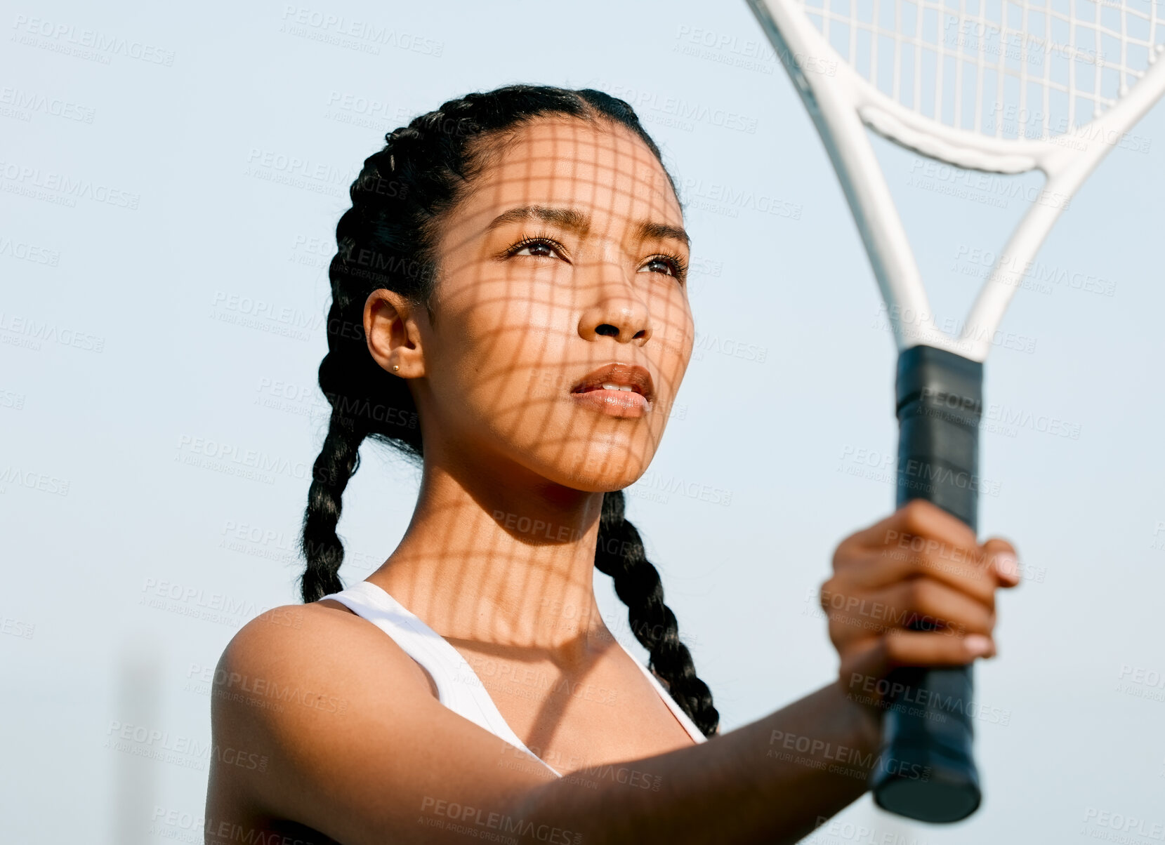 Buy stock photo Fitness, tennis and woman with racket in stadium for practice, competition or cardio workout. Sports, shadow and African person with equipment for physical activity, tournament or training on court