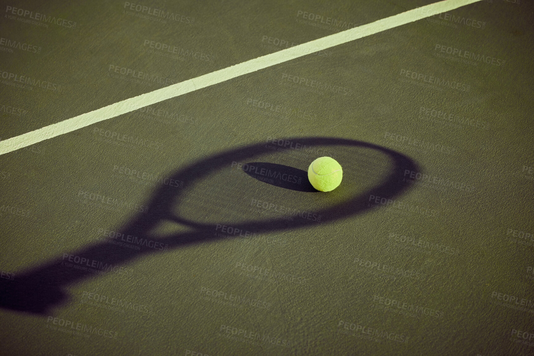 Buy stock photo Shot of a tennis ball lying on a court outlined by the shadow of a racket