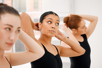 Buy stock photo Shot of a group of ballet dancers fixing their hair together before rehearsing their routine