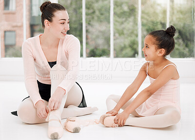 Buy stock photo Shot of a ballet teacher and student taking a break and talking on the floor of a dance studio