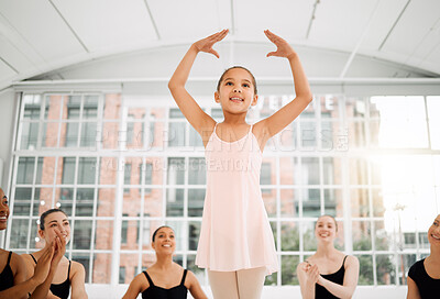 Buy stock photo Shot of a young ballerina performing for her class and looking proud in a dance studio