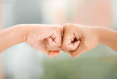 Buy stock photo Cropped shot of two unrecognizable woman bumping fists