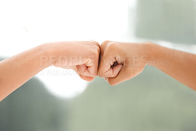 Buy stock photo Cropped shot of two unrecognizable woman bumping fists