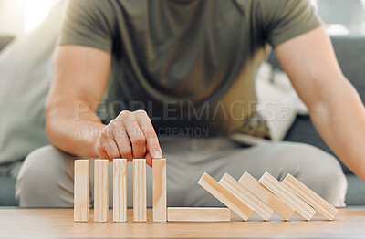 Buy stock photo Shot of a unreconizable man playing with blocks at home
