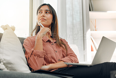 Buy stock photo Shot of a young woman using a  laptop at home
