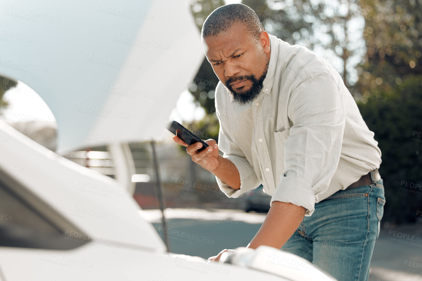 Buy stock photo Shot of a mature male stuck with his car outside