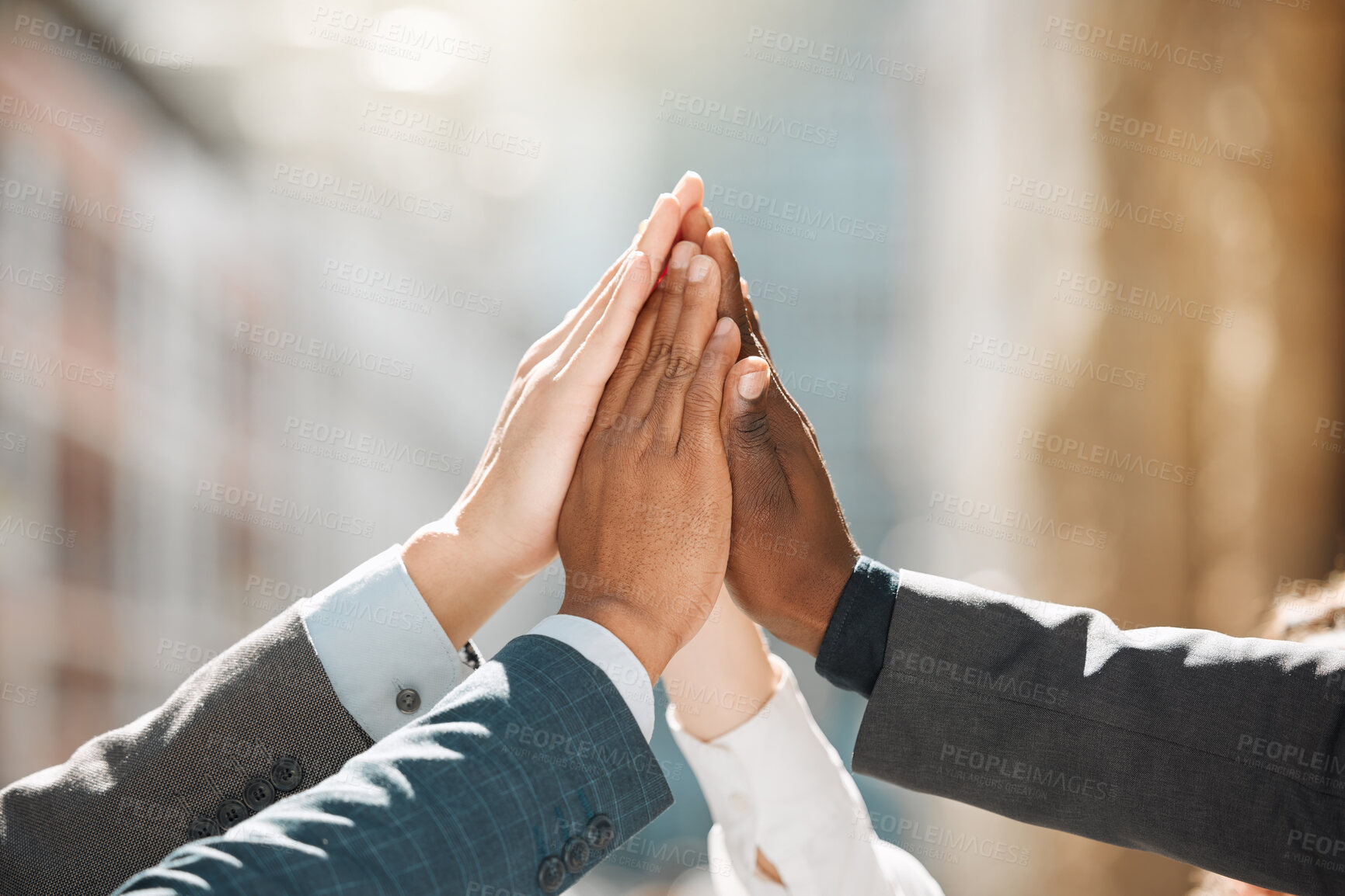 Buy stock photo Shot of a group of businesspeople high fiving one another