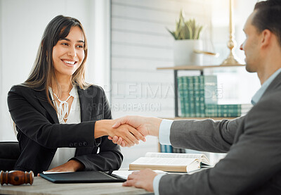 Buy stock photo Shot of a female lawyer shaking hands with her client