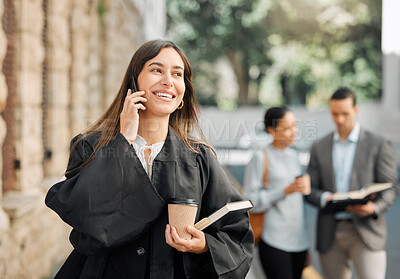 Buy stock photo Shot of a female judge making a phone call using her smartphone