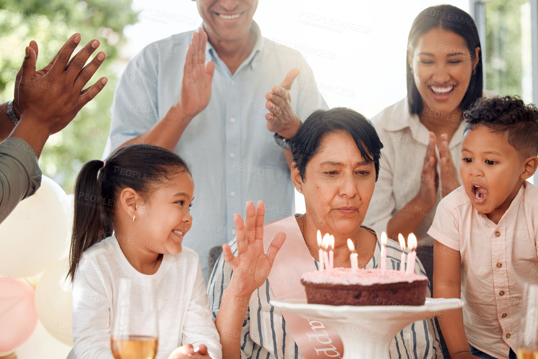 Buy stock photo Mature woman, family and birthday with cake in applause for celebration, age or dessert together at home. Grandmother with candles, clapping or cheering for bonding in event, party or wish at house