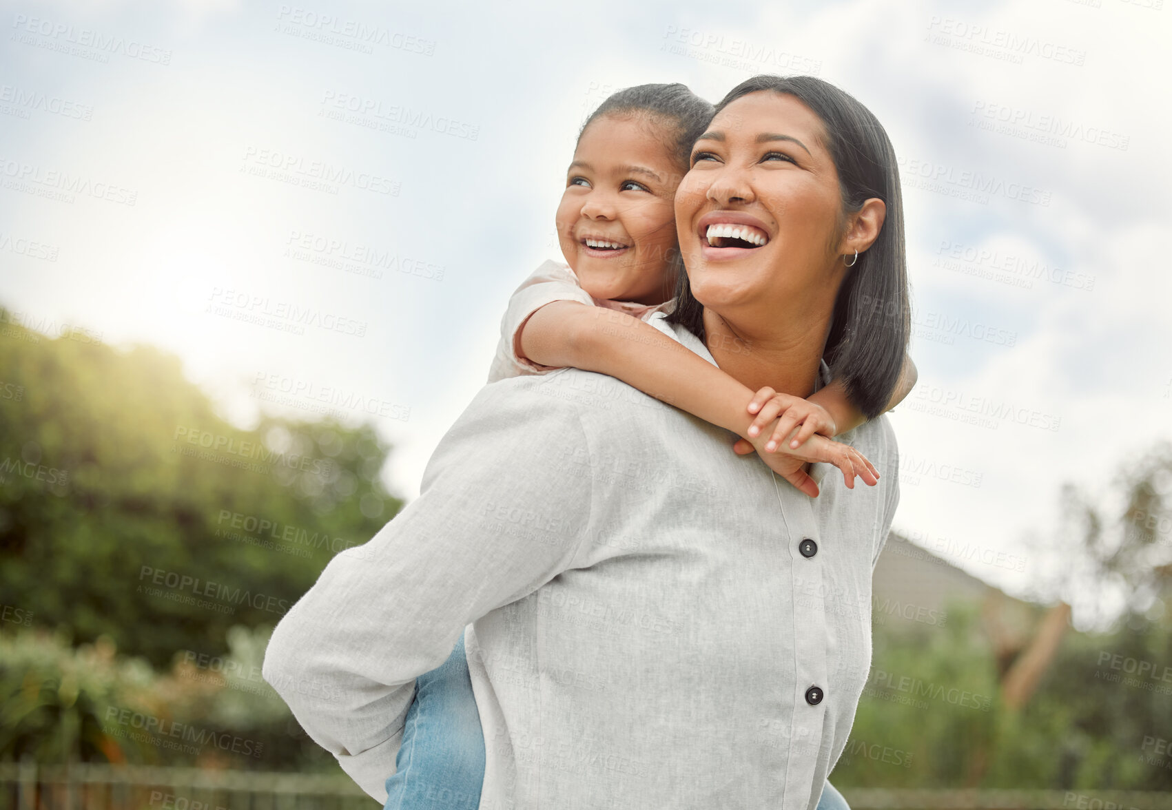 Buy stock photo Shot of an adorable little girl embracing her mother at the park