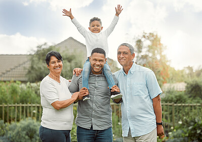 Buy stock photo Shot of a family standing in the backyard