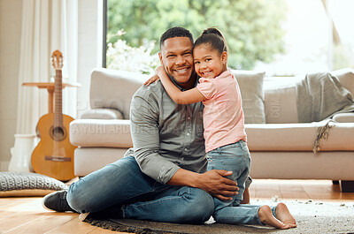 Buy stock photo Portrait of a young father and daughter bonding together at home