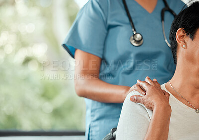 Buy stock photo Cropped shot of a nurse showing comforting her patient after getting bad news