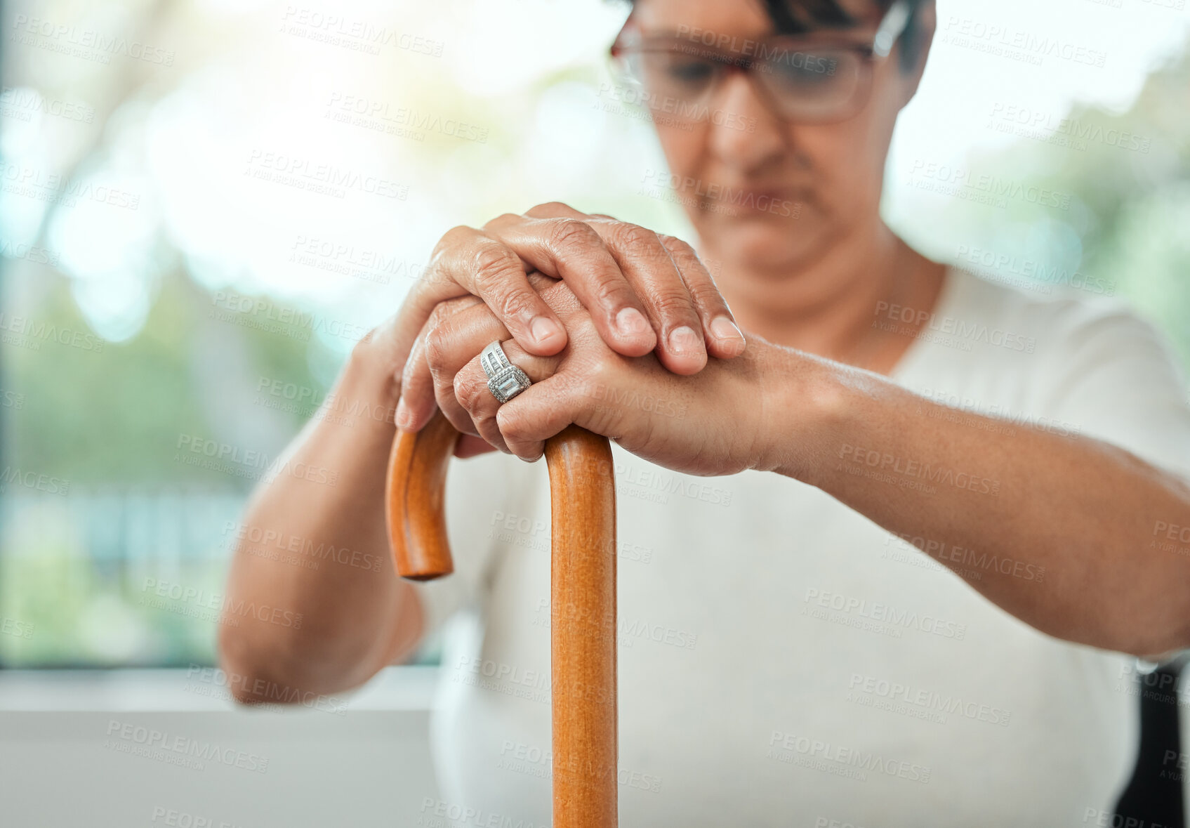 Buy stock photo Hands, senior woman and walking stick at house for mobility support, medical balance and rehabilitation recovery. Wood cane, relax and elderly person with disability for professional help of wellness