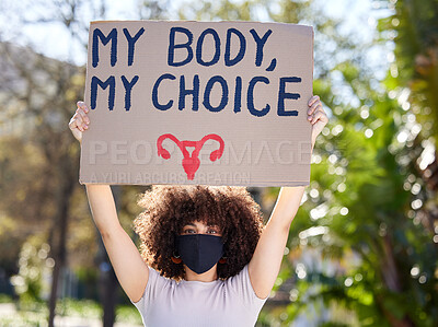 Buy stock photo Woman, portrait and poster for outdoor protest on abortion, body choice or freedom of human rights. Feminism, cardboard and female person with mask for equality, political change or safe decision