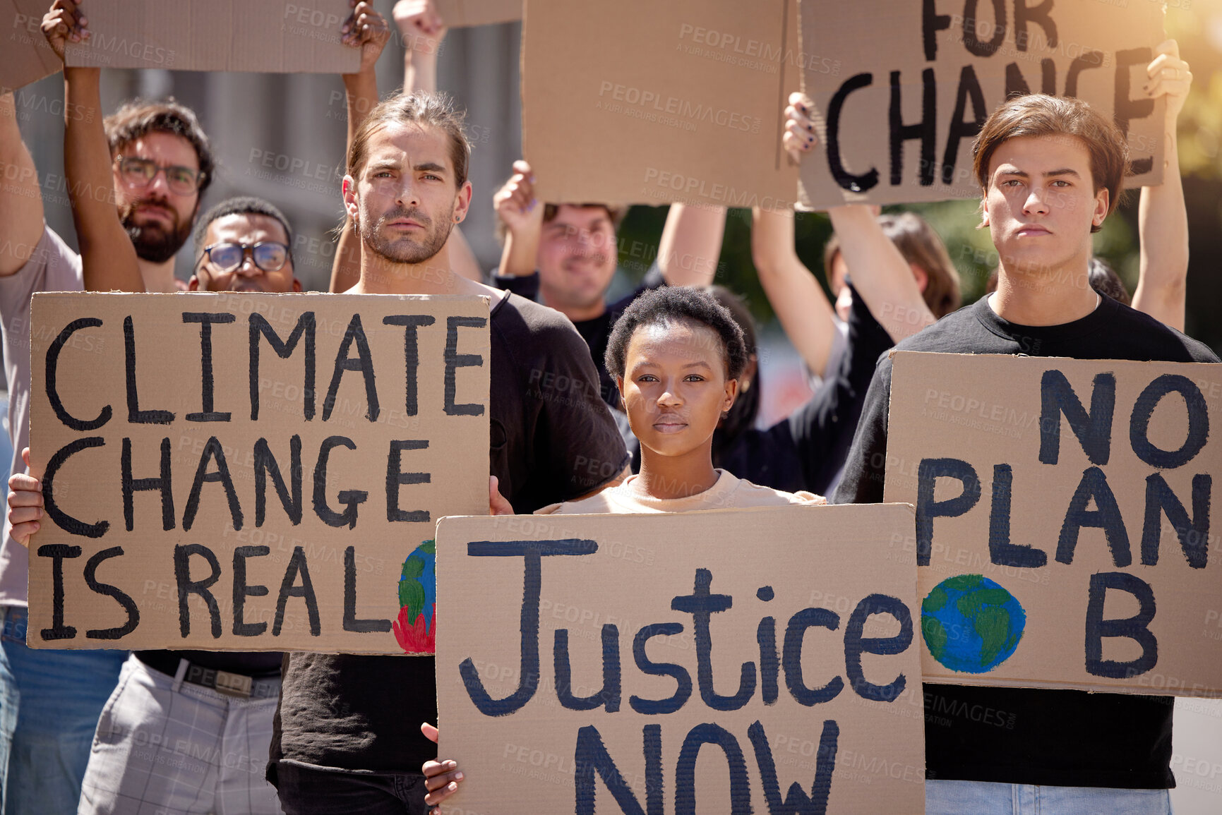 Buy stock photo Shot of a group of people protesting climate change