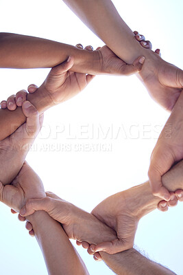 Buy stock photo Shot of a group of diverse people with their arms interlinked