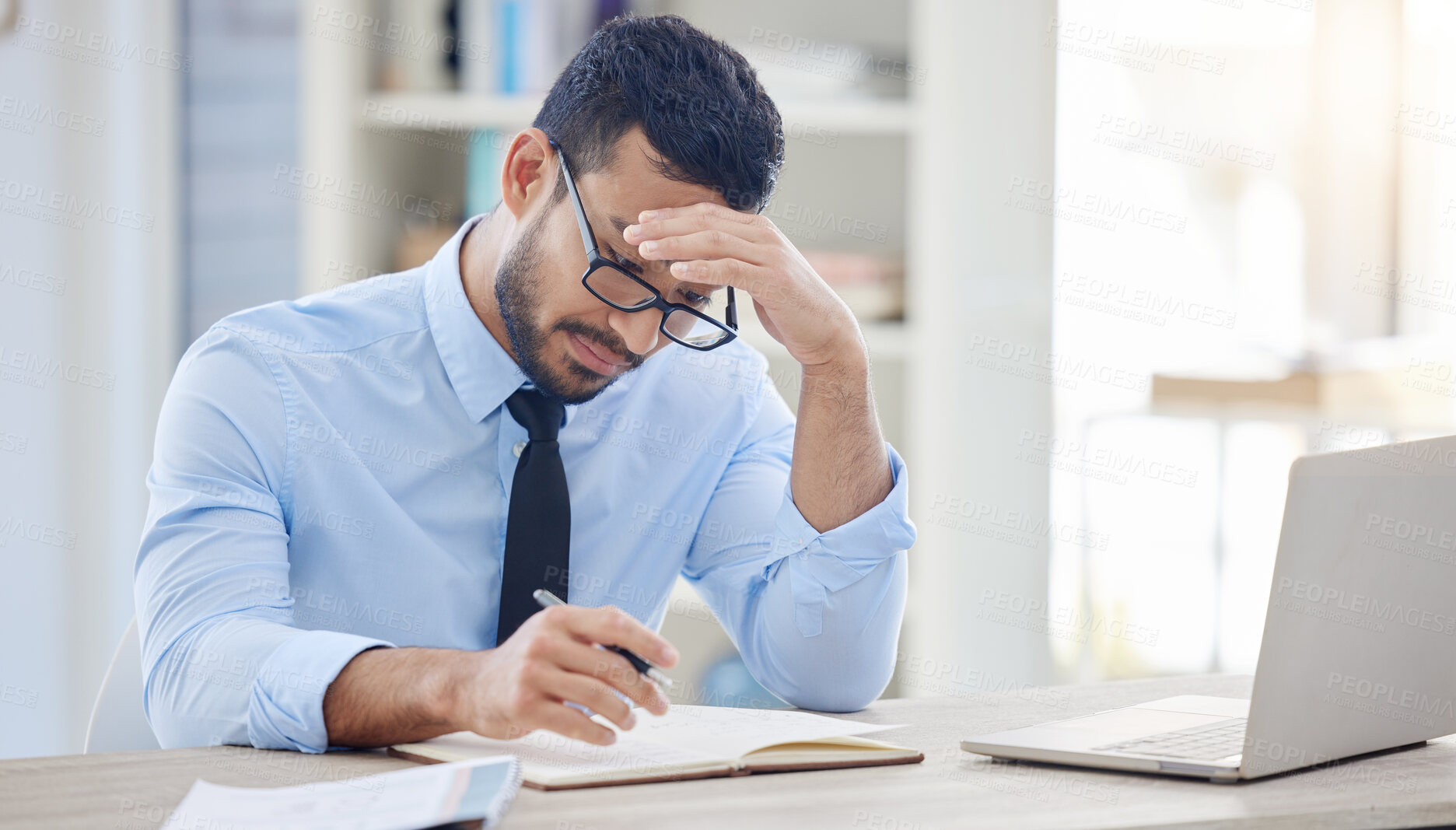 Buy stock photo Headache, man and stress in office for deadline, debt and overworked in workplace. Male lawyer, frustrated and laptop at desk with anxiety, burnout and tired at desk from workload, pressure and work