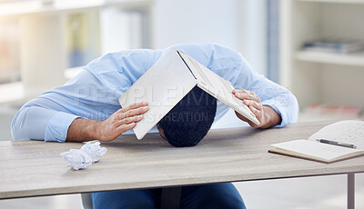 Buy stock photo Frustrated, business man and laptop on head with documents in office for overworked, burnout or stress. Male person, mental health or tired with career problems for fatigue, depressed or deadline