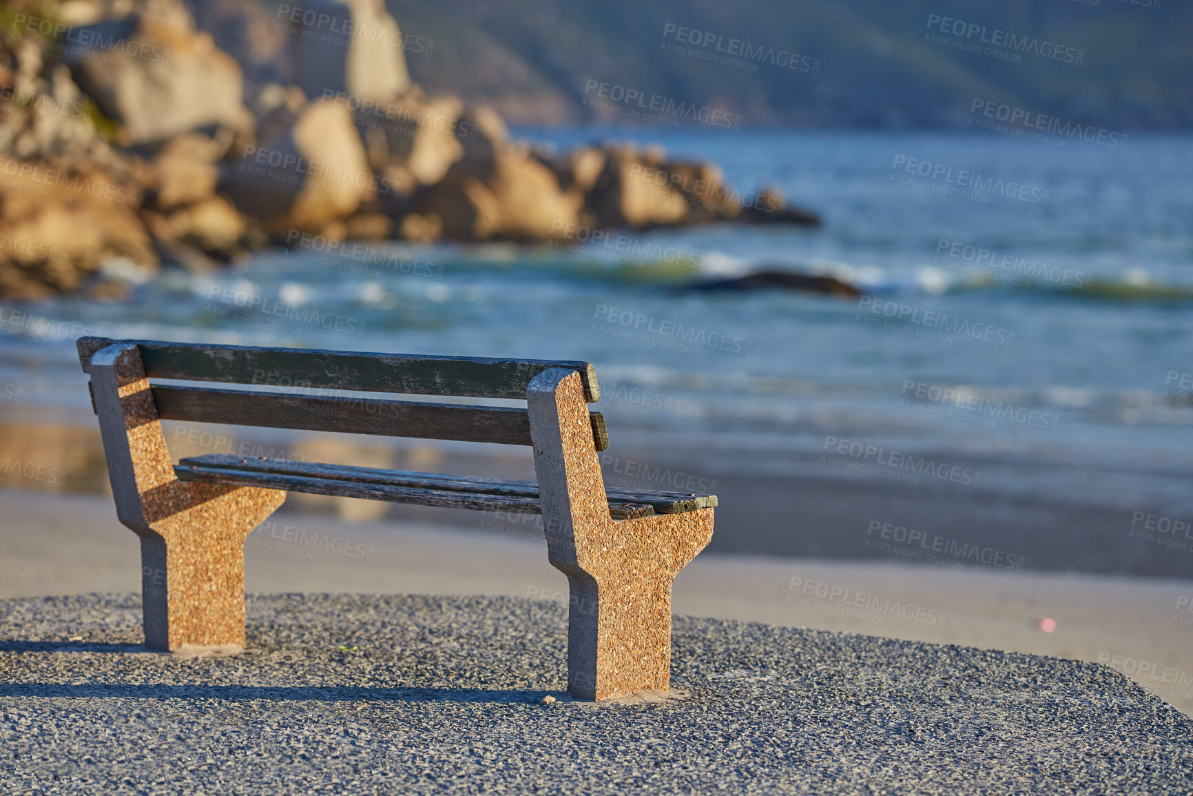 Buy stock photo Relaxing bench with sea or ocean view to enjoy calm, peaceful and zen nature with waves washing on shore in a remote area. Scenic seating with blurred copy space in a coastal park on the promenade