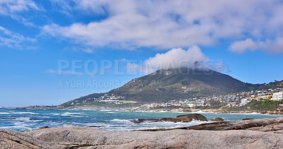 Buy stock photo Beautiful view of a blue ocean on the rocky coast of Western Cape, South Africa, against a cloudy sky background with copy space. Soothing, tranquil water in harmony with nature and fresh air 