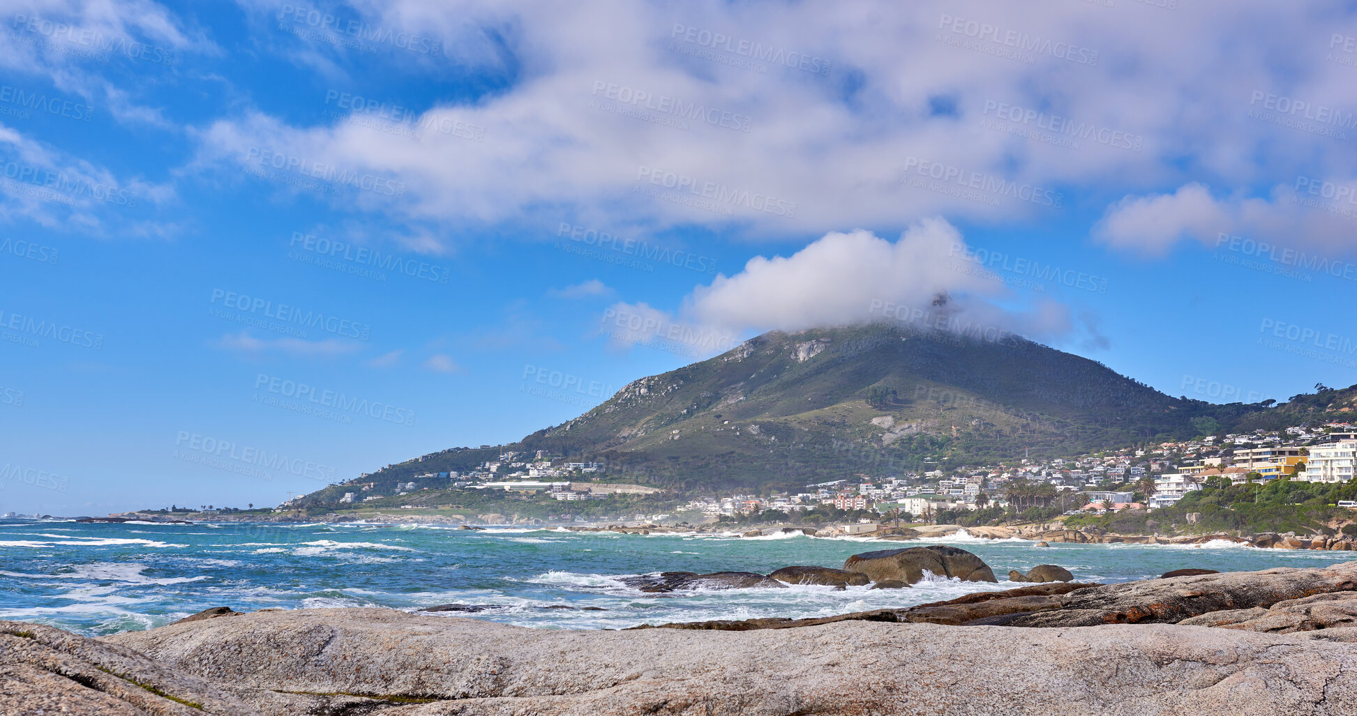 Buy stock photo Beautiful view of a blue ocean on the rocky coast of Western Cape, South Africa, against a cloudy sky background with copy space. Soothing, tranquil water in harmony with nature and fresh air 