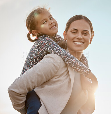 Buy stock photo Happy mother, portrait and piggyback with child for fun bonding, holiday or weekend together in nature. Mom carying daughter, little girl or kid on back with blue sky or sunrise for outdoor walk