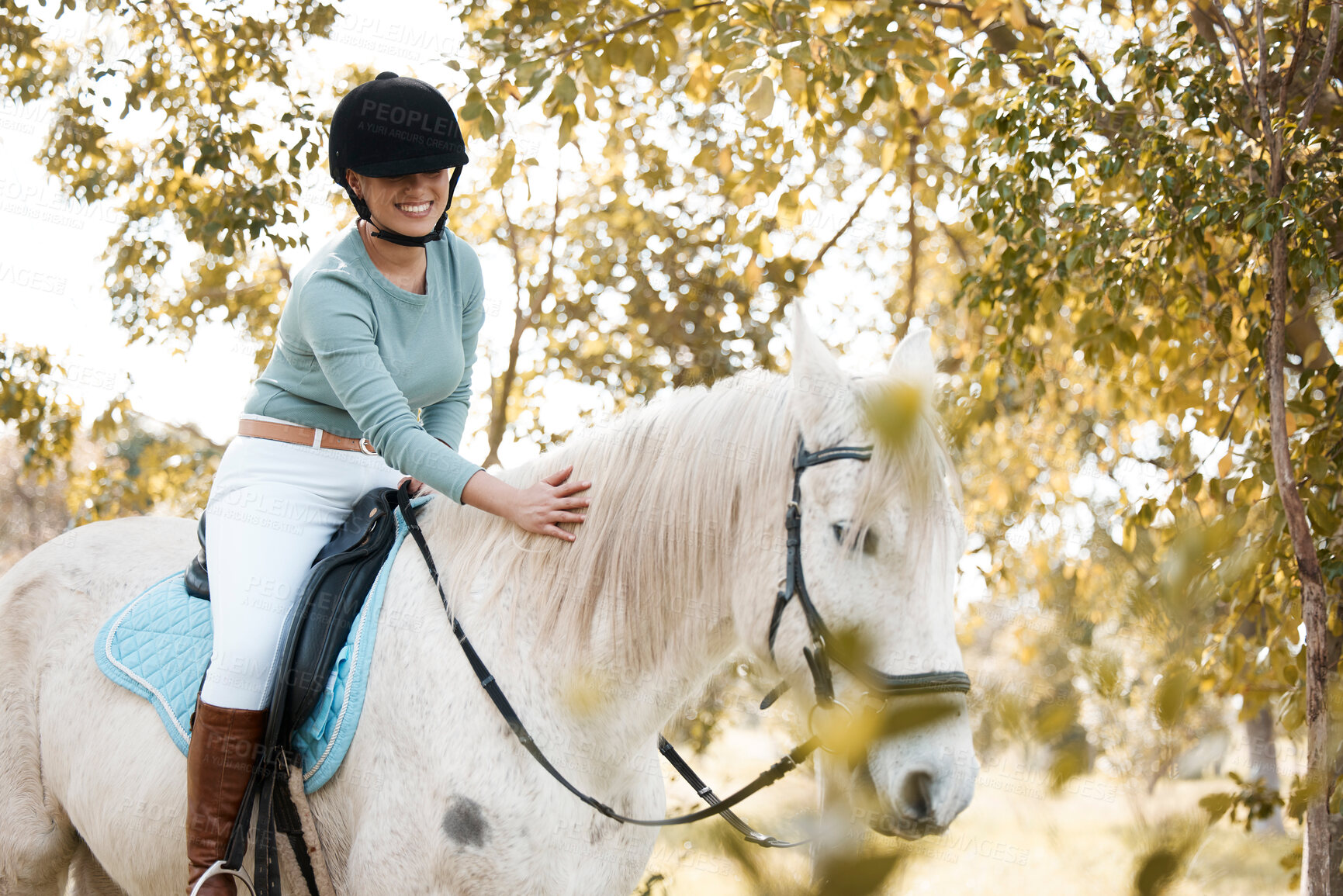 Buy stock photo Woman, smile and riding horse in forest for ride with care, love and hobby in California. Female person, countryside and happy in woods for adventure, fun and relax on break for activity as rider